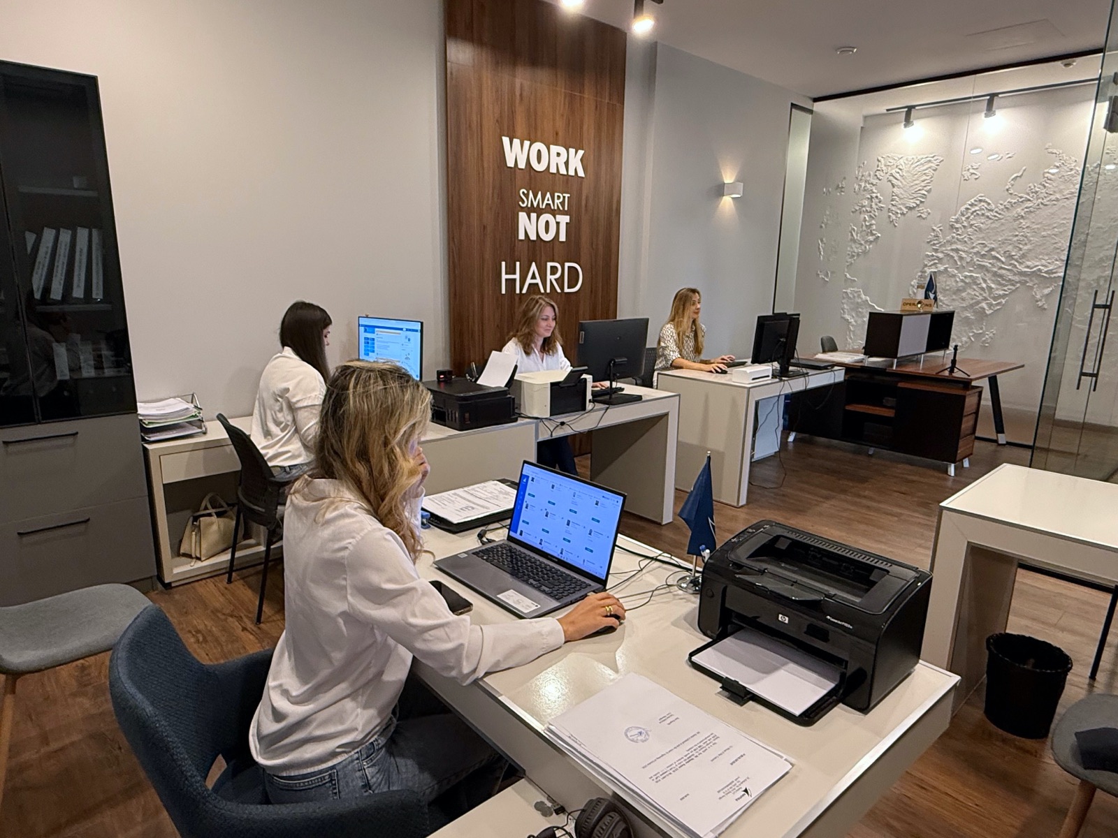 Nautica crewing coordinators at their desks in the company office