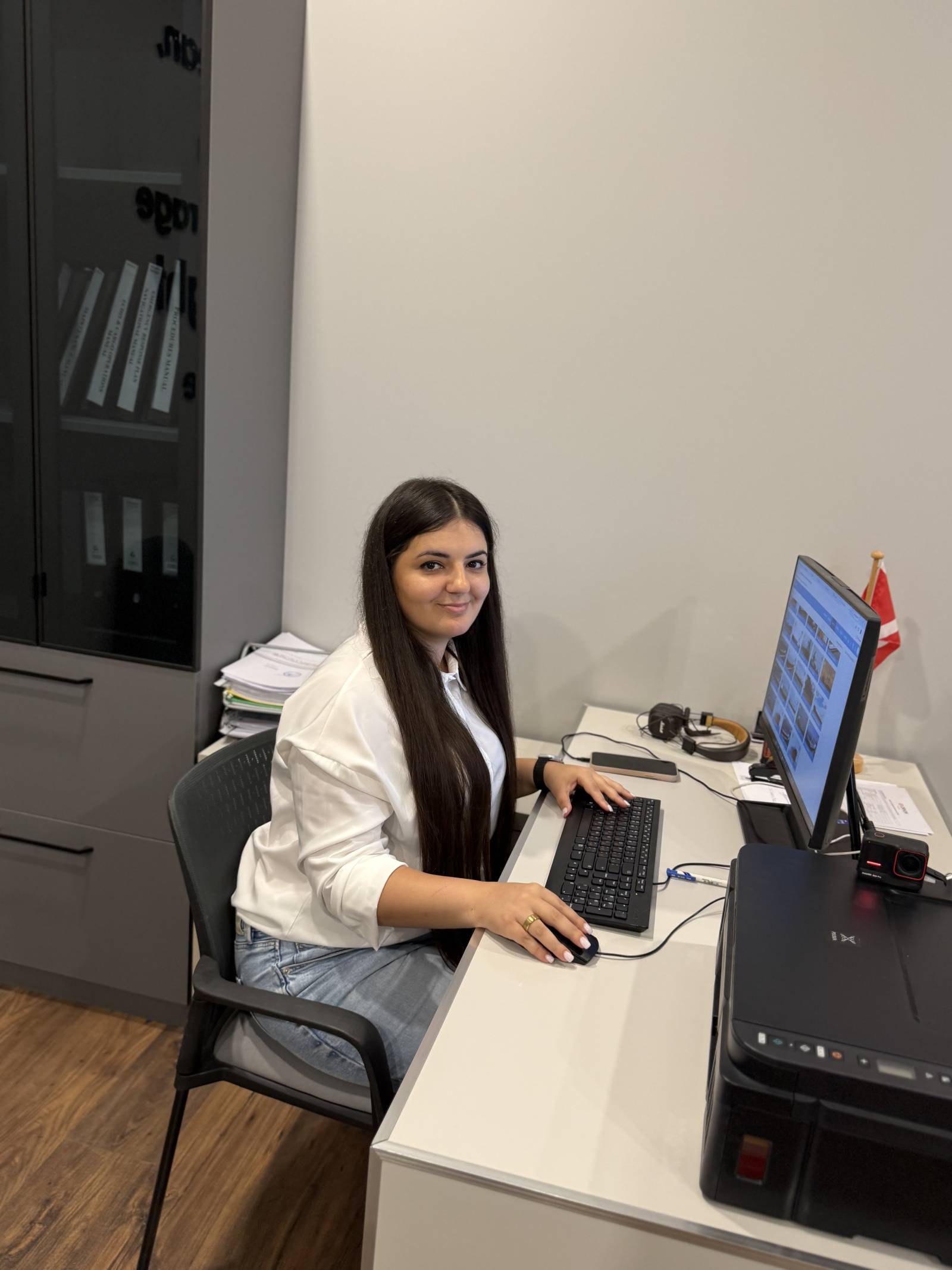 Nautica crewing specialist working at her desk