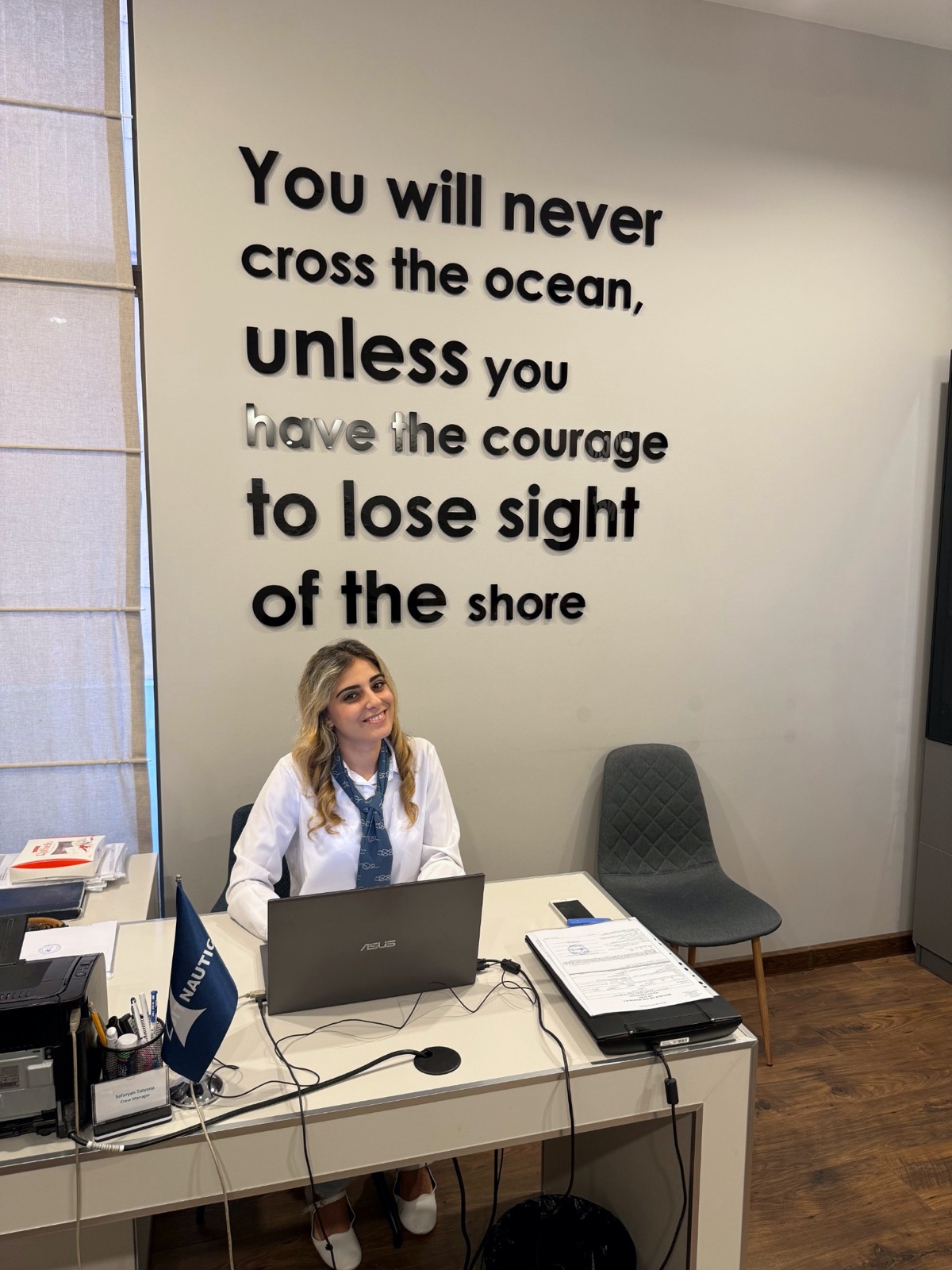 Nautica crew manager at her desk